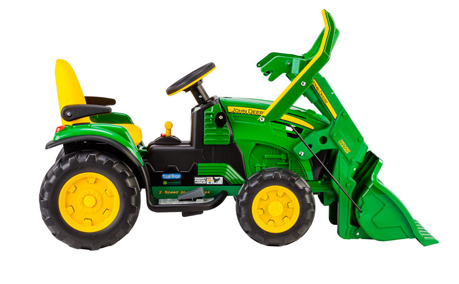 Green and yellow electric ride-on tractor with front loader, adjustable seat, and large traction wheels for kids' outdoor play