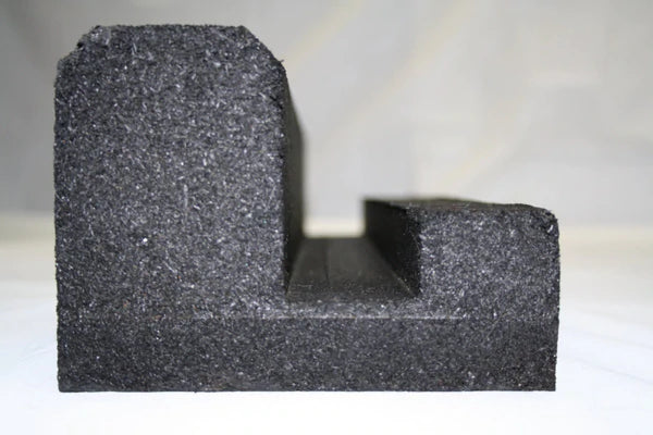 Black molded recycled rubber J-shaped curb with key-way channel for securing loose fill and turf containment