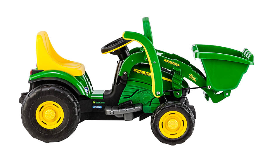 Green and yellow children's ride-on loader with front scoop bucket, large wheels, and adjustable seat