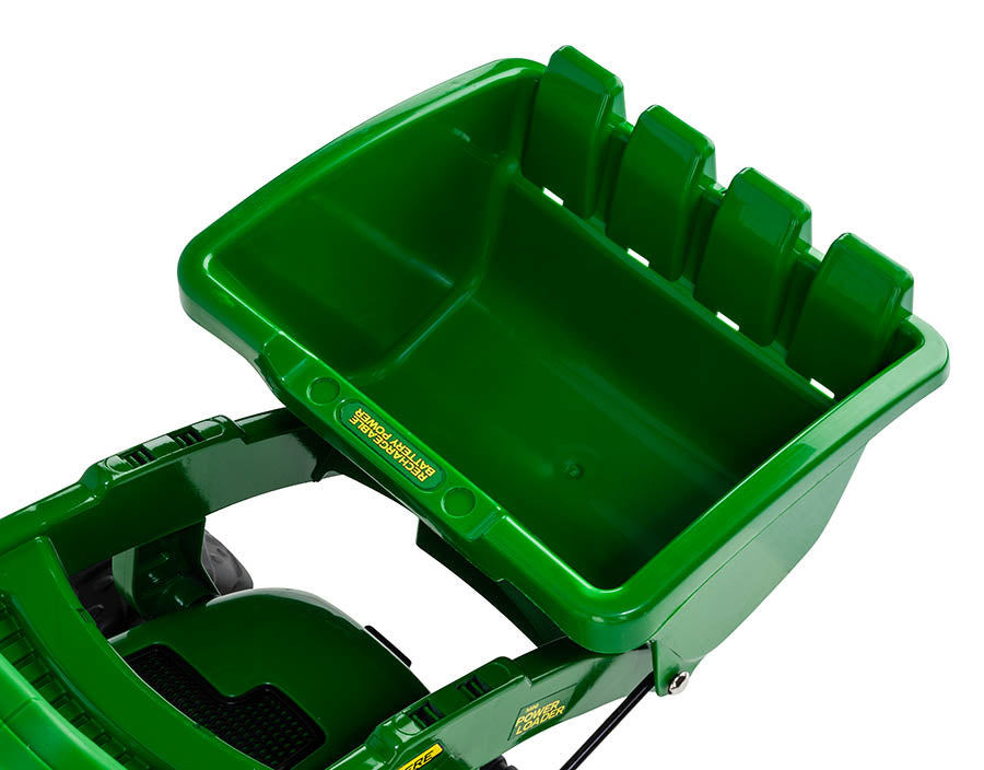 Green front bucket attachment on a battery-powered children's ride-on loader with rechargeable battery label