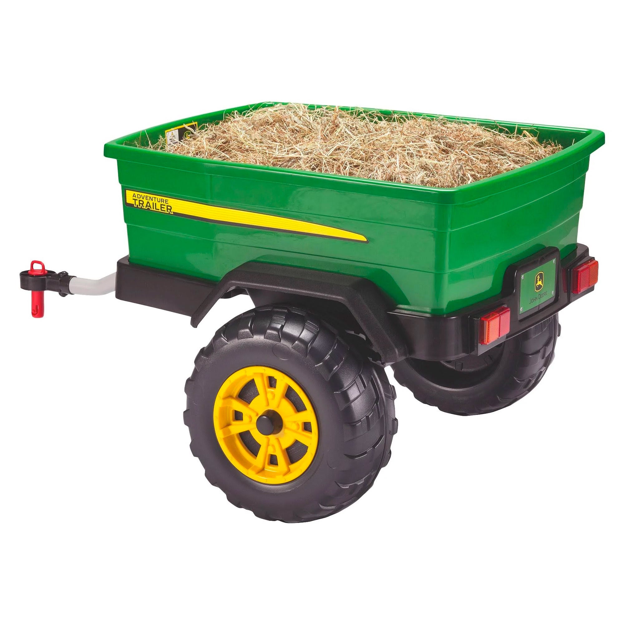 Green toy trailer with rugged yellow wheels filled with hay, designed to attach to children's riding vehicles