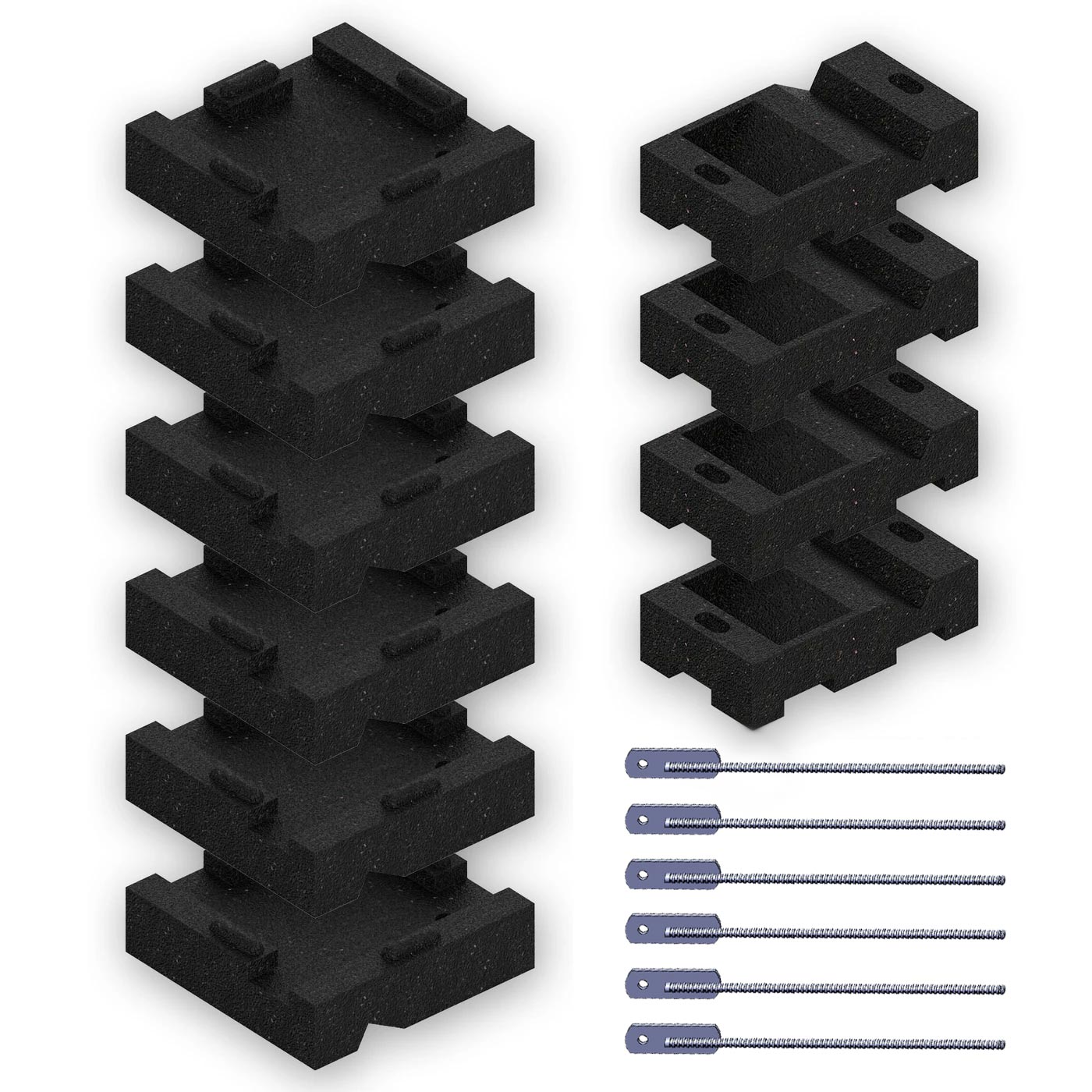 Overhead view of black foam leveling blocks stacked in two columns beside six metal anchoring stakes for swing set stabilization