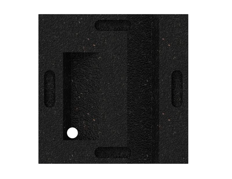 Overhead view of a black textured plastic leveling block with recessed handles and a small white circular marker, designed for playset support and ground moisture protection.