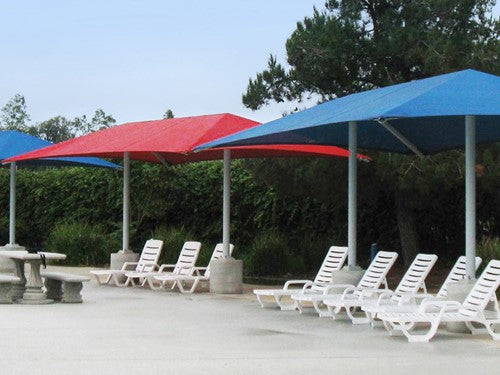 Hip Roof Shade Structure with 2 Posts in red and blue providing UV protection over poolside lounge chairs and picnic tables