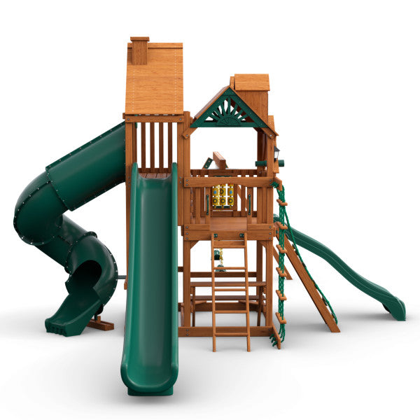 Cedar wooden playset with two green slides, climbing wall, rope ladder, and tic-tac-toe panel.