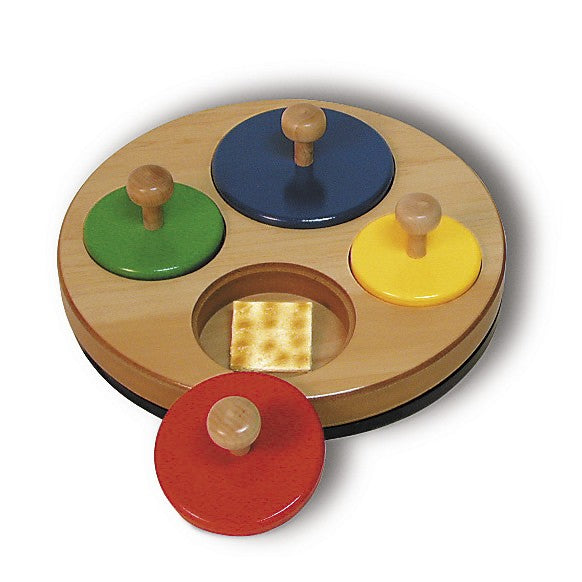 Memory Circles wooden four-part circle puzzle with colorful knobs, spinning base, and hidden object spaces for memory play