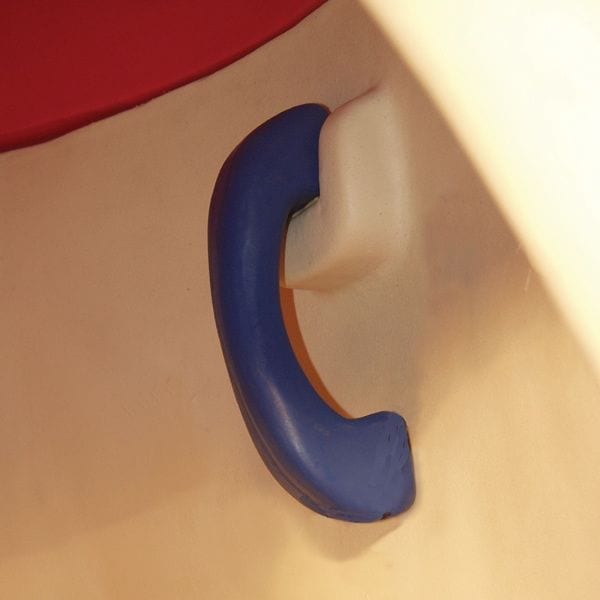 Blue curved handle on beige molded plastic children's play equipment with tactile shapes for sensory play.