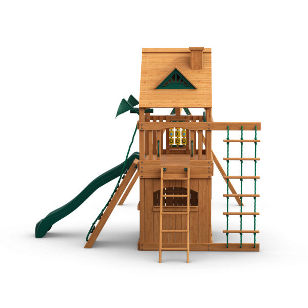 Cedar wooden swing set with upper clubhouse, green slide, climbing rope ladder, tic-tac-toe panel, and lower playhouse.