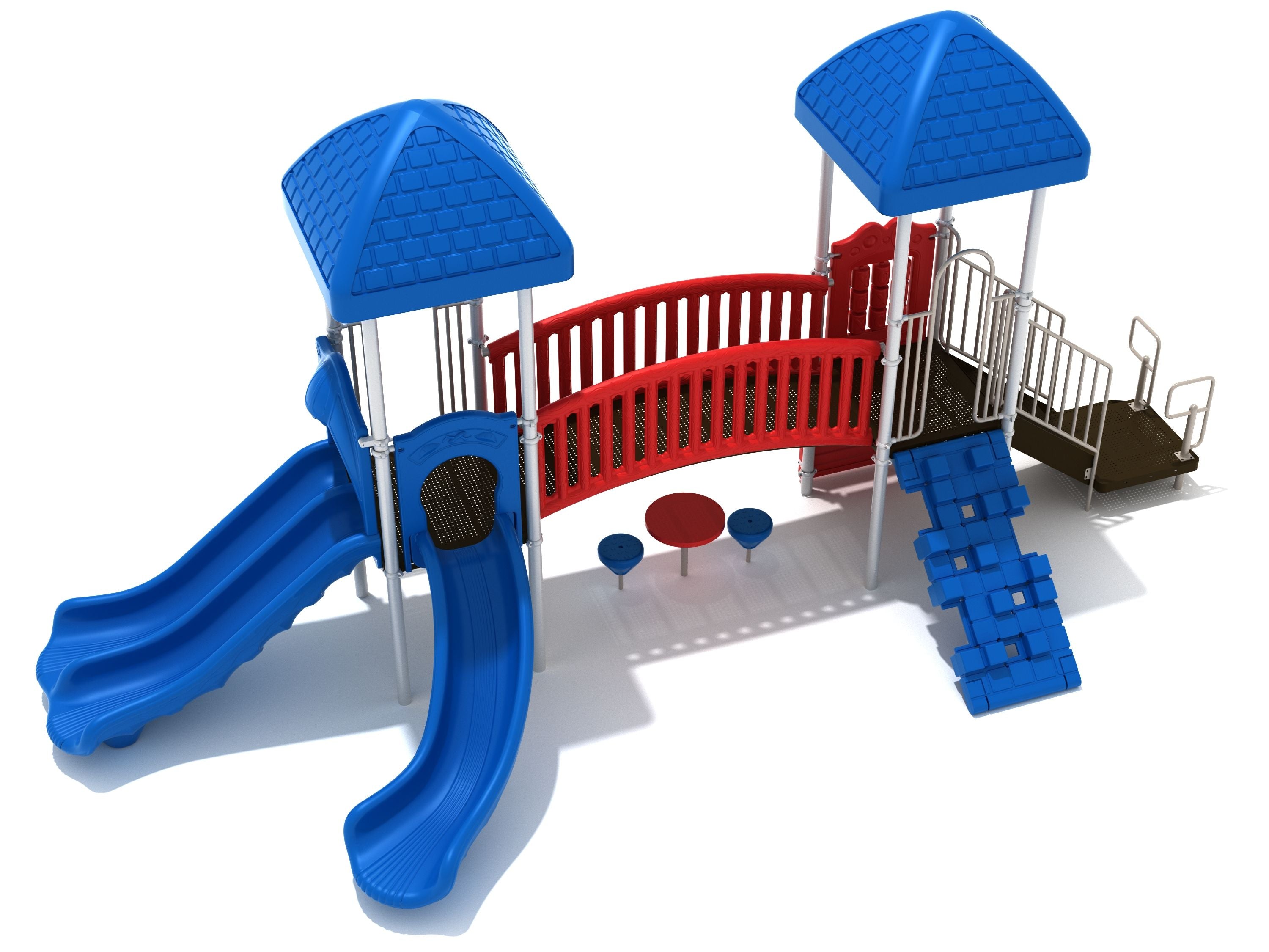 Playground with two blue-roofed towers connected by a red arched bridge, featuring blue slides, a climber, and a shaded table with pebble seats underneath.