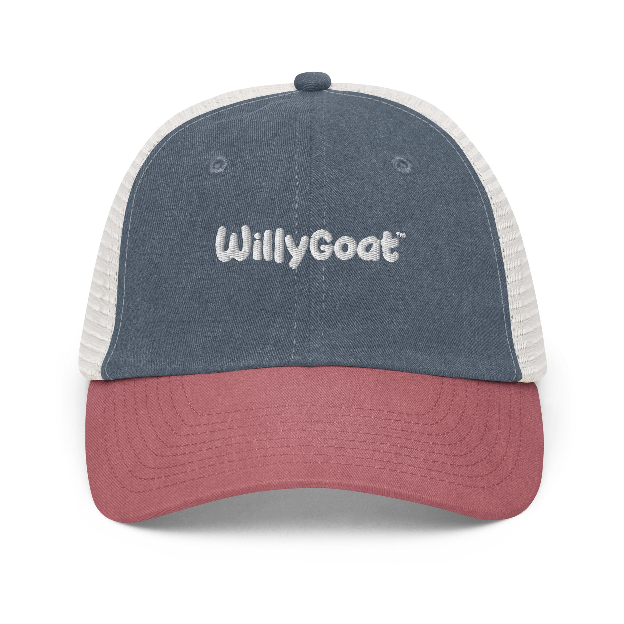 Pigment-dyed trucker hat with navy twill front, white mesh back, and cardinal red curved visor, low-profile six-panel design