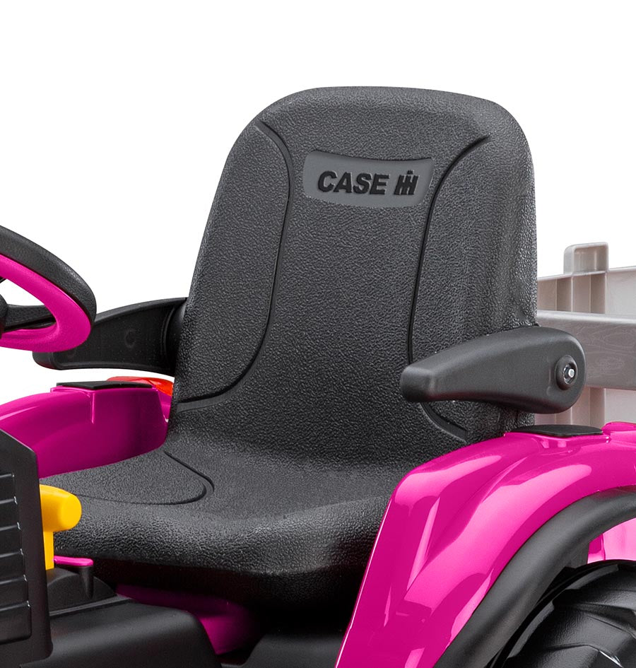 Pink ride-on tractor with black seat, armrests, steering wheel, and detachable stake-side trailer for outdoor play.