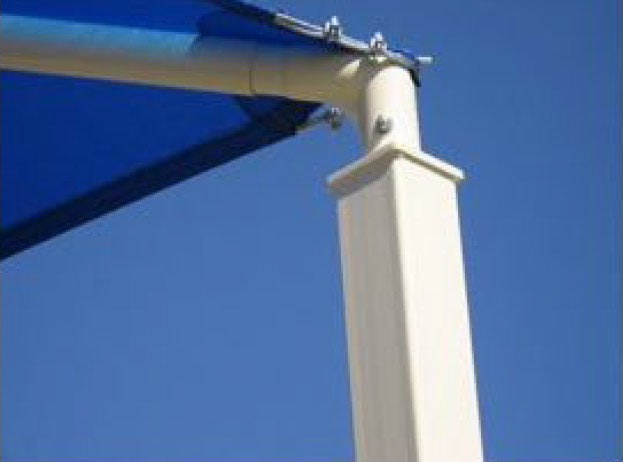 White metal post with quick-release hardware securing blue fabric shade against clear sky