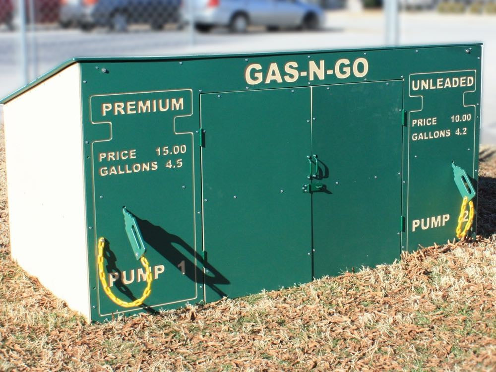 Green outdoor trike storage unit shaped like a gas pump with lockable double doors and toy pump handles
