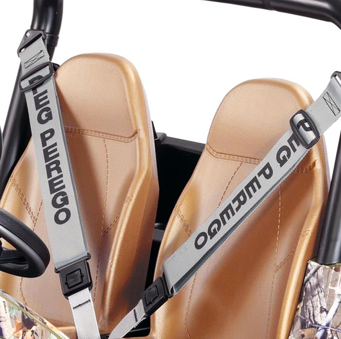 Tan bucket seats with gray branded seat belts on camo-patterned kids’ ride-on vehicle with cargo bed and 2-speed shifter