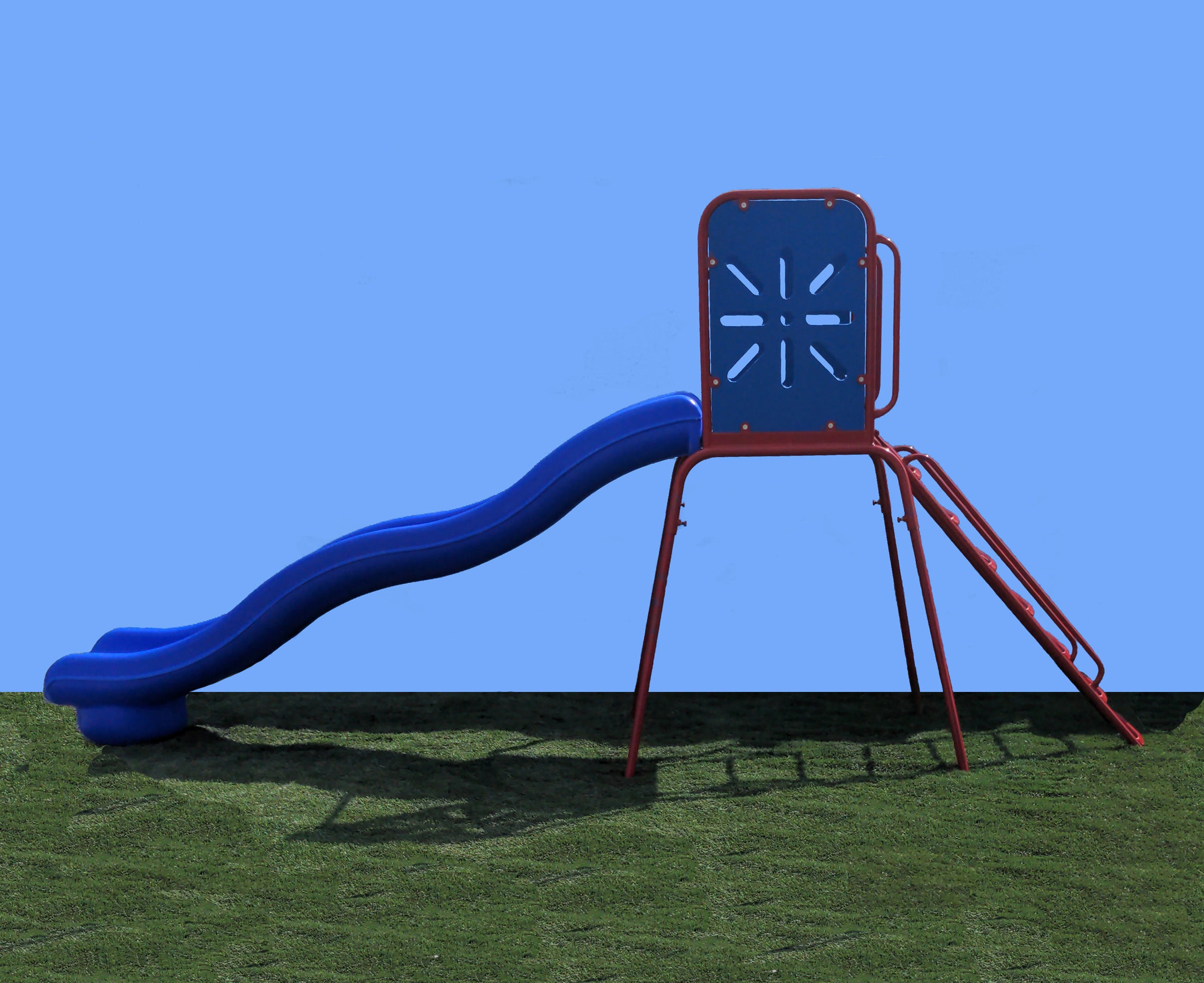 Blue wavy playground slide with red metal frame, ladder, and platform on green grass under clear sky