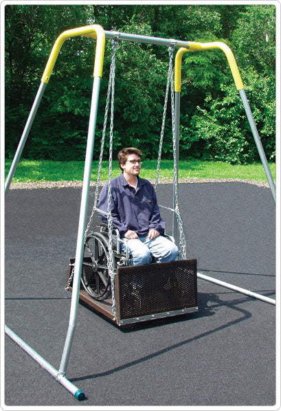 ADA accessible swing with metal frame and platform, featuring a person in a wheelchair outdoors on the swing.