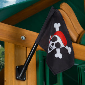 Black pirate flag with skull and crossbones wearing red bandana mounted on wooden playset pole