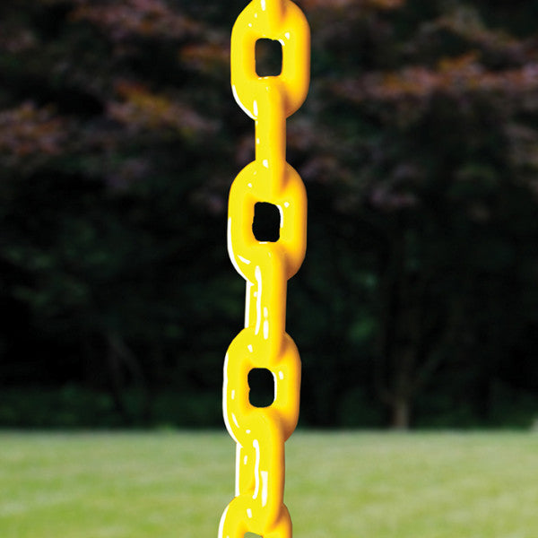 Bright yellow plastic swing chain links with blurred green grass and trees in the background