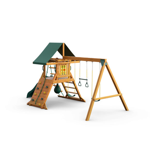 Cedar wooden playset with green canopy, rock climbing wall, wave slide, swings, trapeze, and tic-tac-toe panel