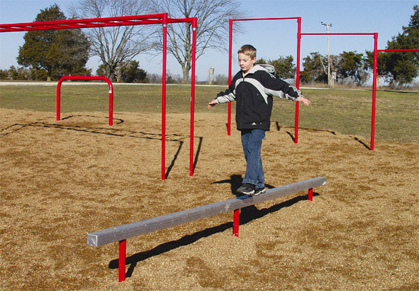 Straight galvanized Balance Beam fitness obstacle with child balancing outdoors on playground mulch surface