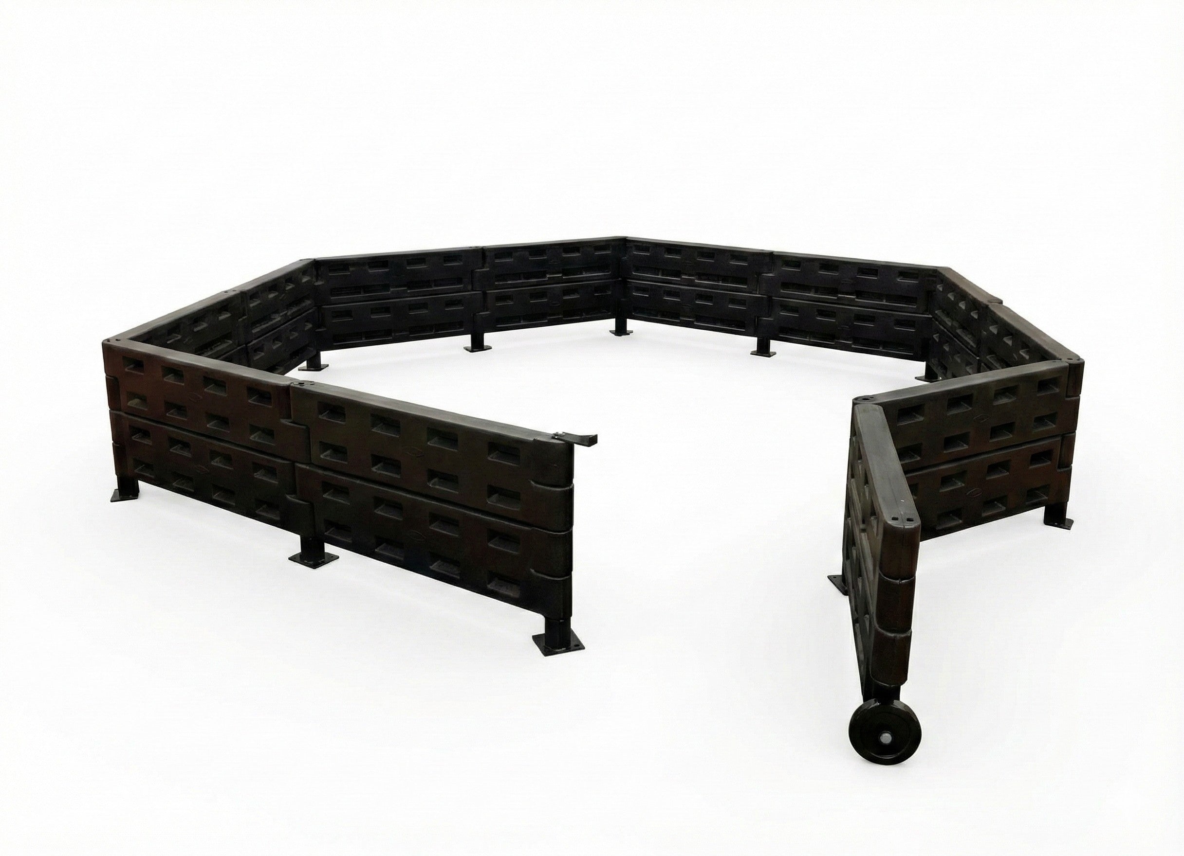 Gaga Flooring Kit with modular black interlocking rubber tiles and connected black plastic walls forming an octagonal GaGa ball pit on red carpet