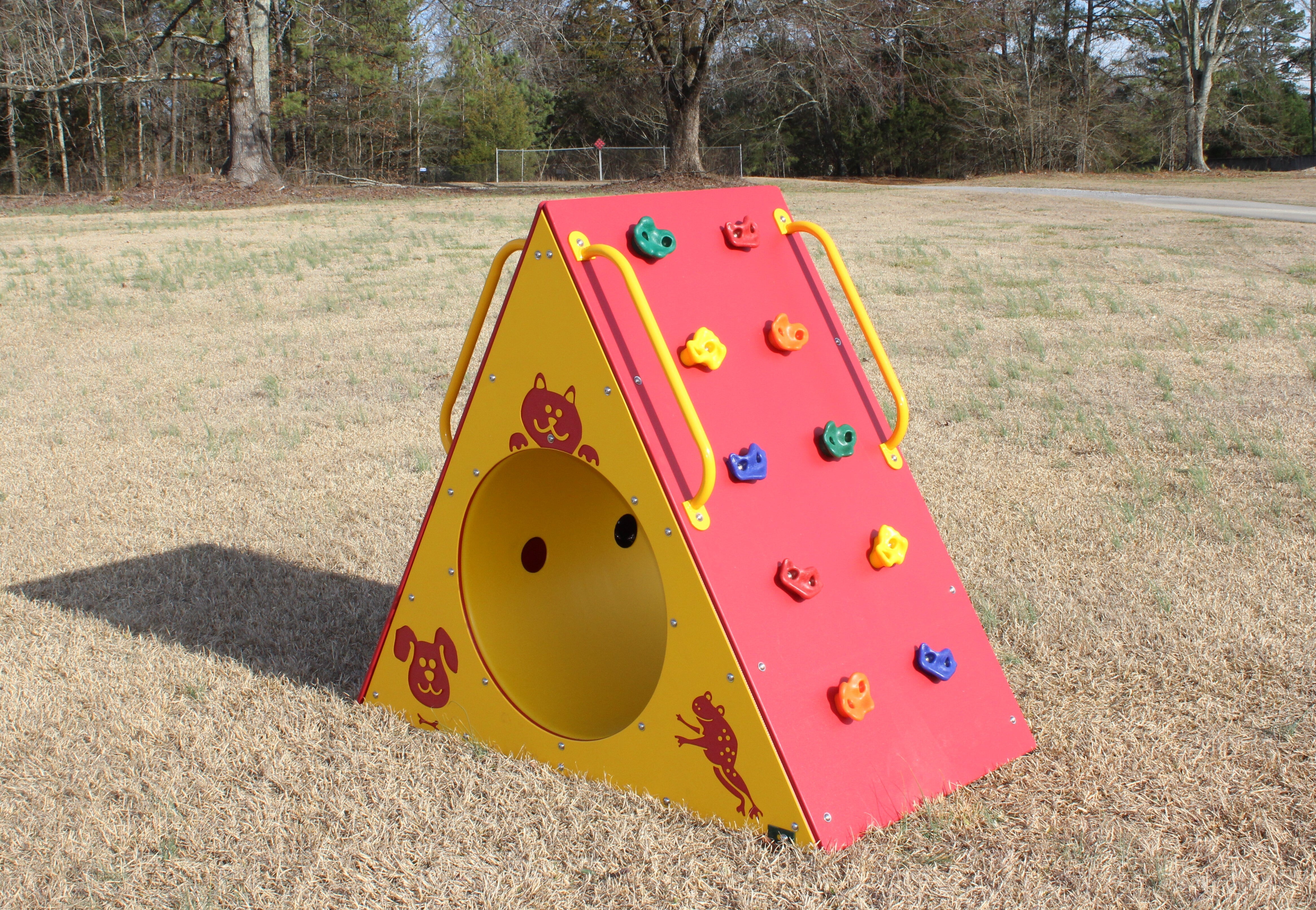 Climbing Wall With Tunnel featuring red climbing wall with colorful holds, yellow tunnel entrance with animal graphics, and yellow handrails
