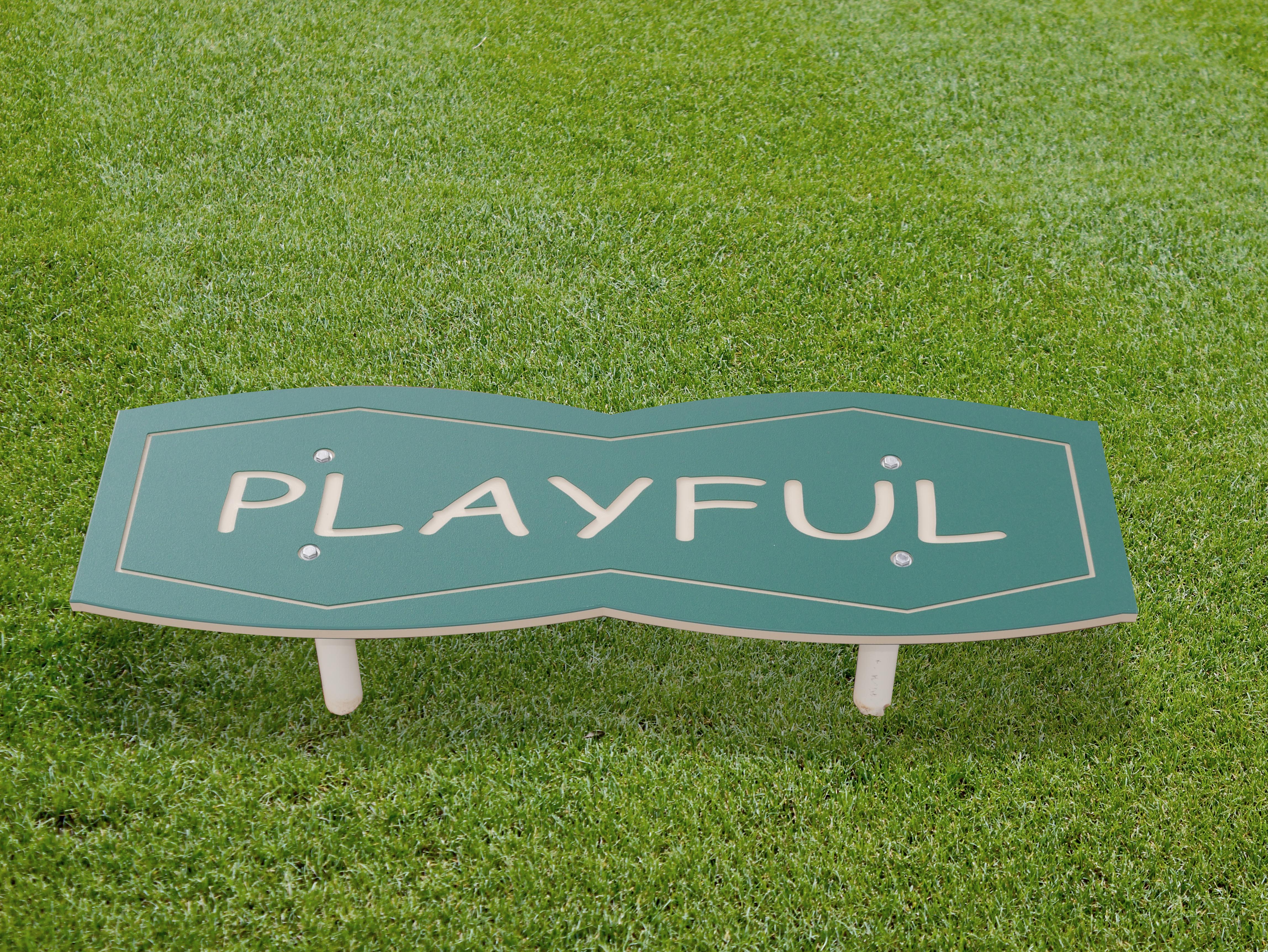 Green outdoor park bench with playful-themed cutout letters, durable and kid-friendly for playground seating.