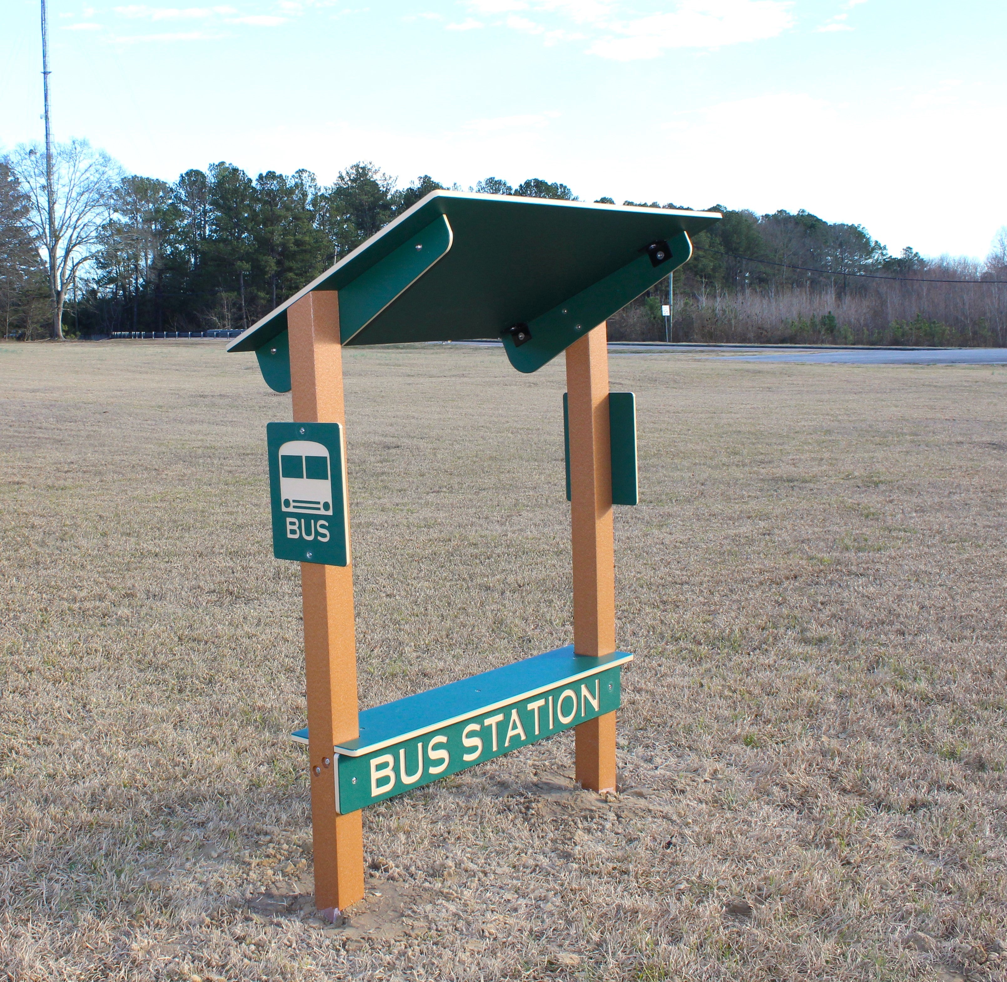 Bus Station Bench with green shaded roof, durable posts, and bus sign, designed for playground imaginative play