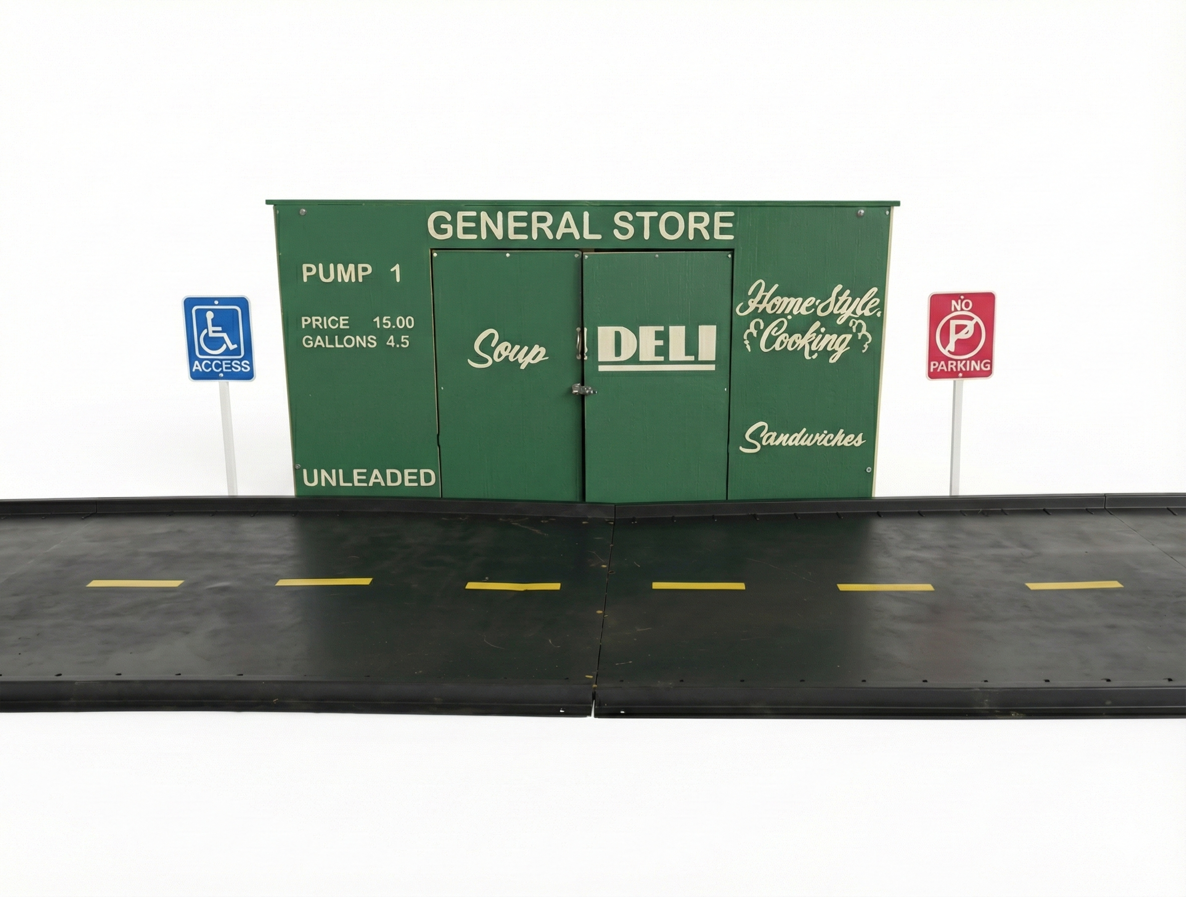 Trike Storage General Store playhouse with green facade, gas pump details, and integrated trike paths for outdoor commercial play