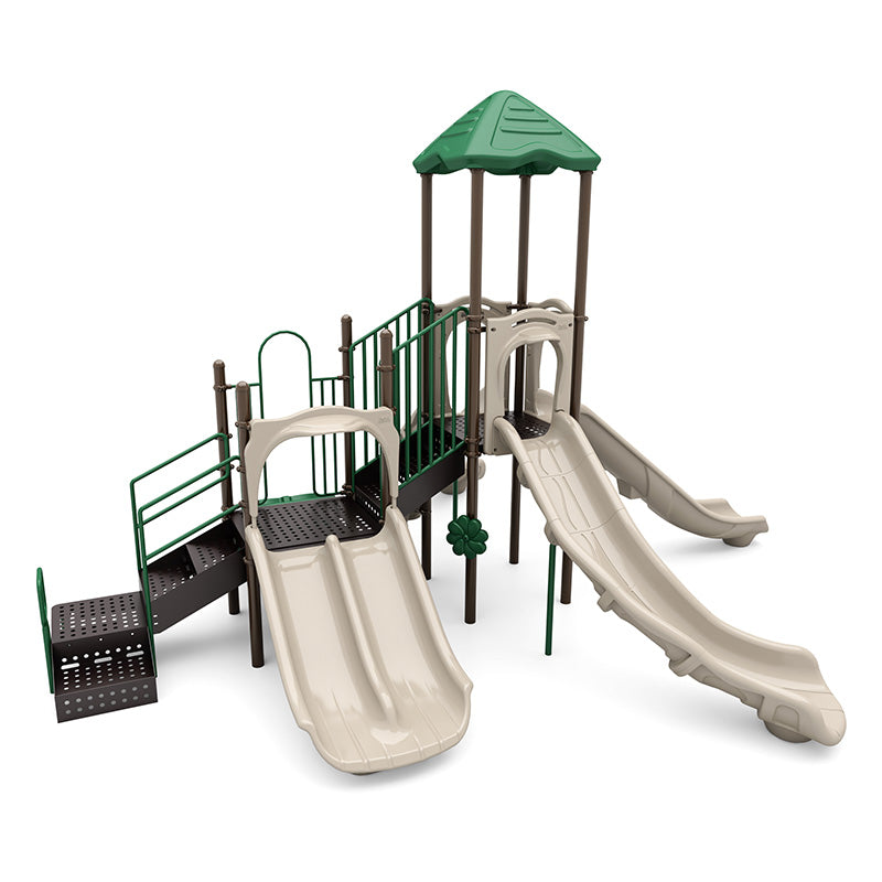 Playground structure with three beige slides including a double slide, green roof, brown posts, green railings, and climbing stairs.