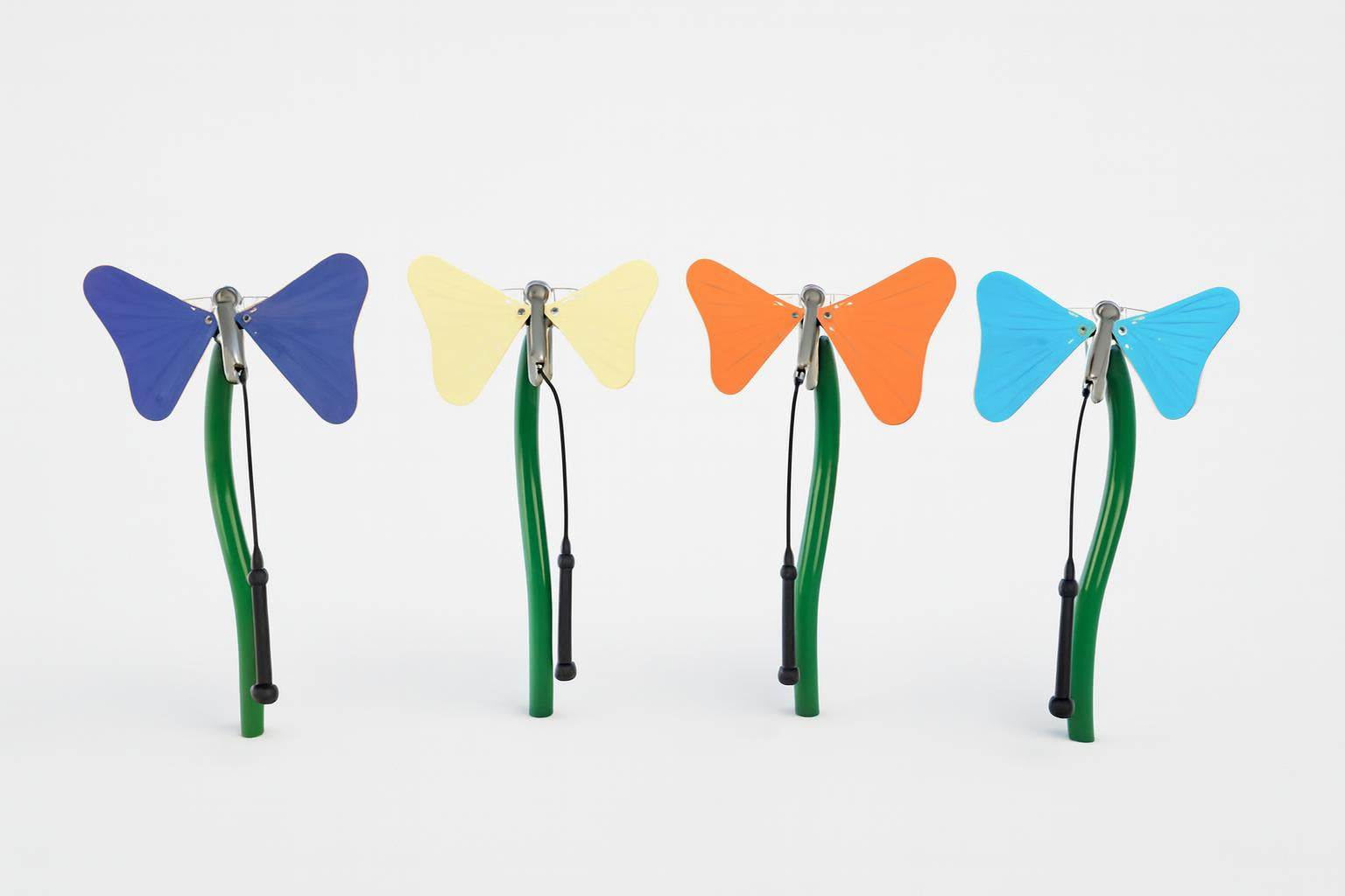 Toddler Butterfly Ensemble with four colorful butterfly-shaped outdoor musical instruments in indigo, yellow, orange, and turquoise