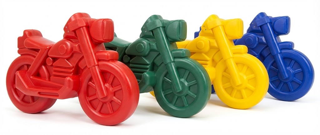 Roto Molded Spring Ride Motorcycle in red polyethylene with smooth rounded design and enclosed rubber spring for safe play