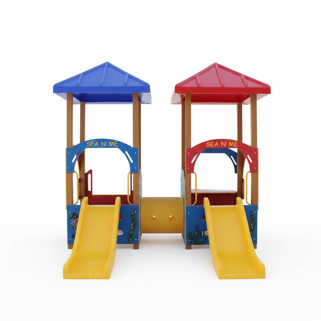 Sea N Me Tot Structure toddler playset with dual yellow slides, blue and red roofs, and a fish-themed connecting tunnel