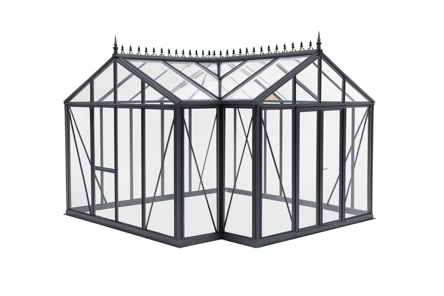 Royal Victorian Orangerie Greenhouse with dark green aluminum frame, tempered glass panels, decorative roof cresting, and double sliding door in garden setting