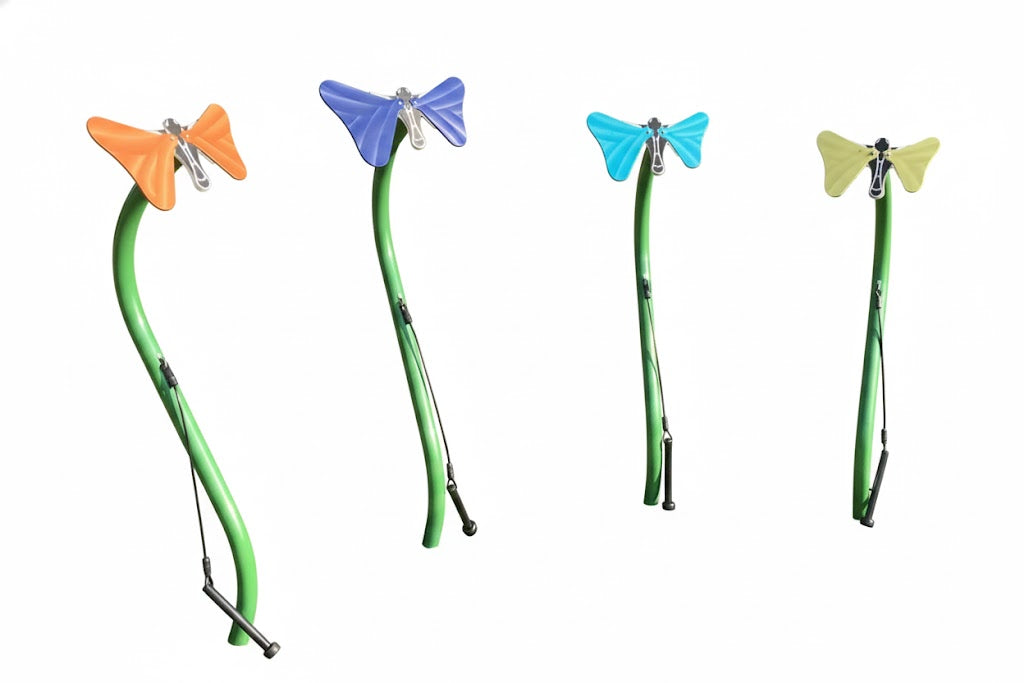 Butterflies Outdoor Musical Park Instrument with colorful butterfly-shaped anodized aluminum bells on green stems in grassy park setting