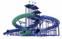 Sub-Collection image The Indian Ocean Water Slide with three large blue and green curved enclosed slides, blue metal framework, roofs, and flags by a pool